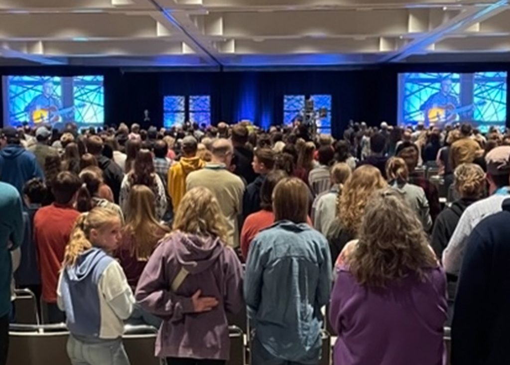 Mike Birkeland leading worship at the 2025 Minnesota Association of Christian Home Educators convention.